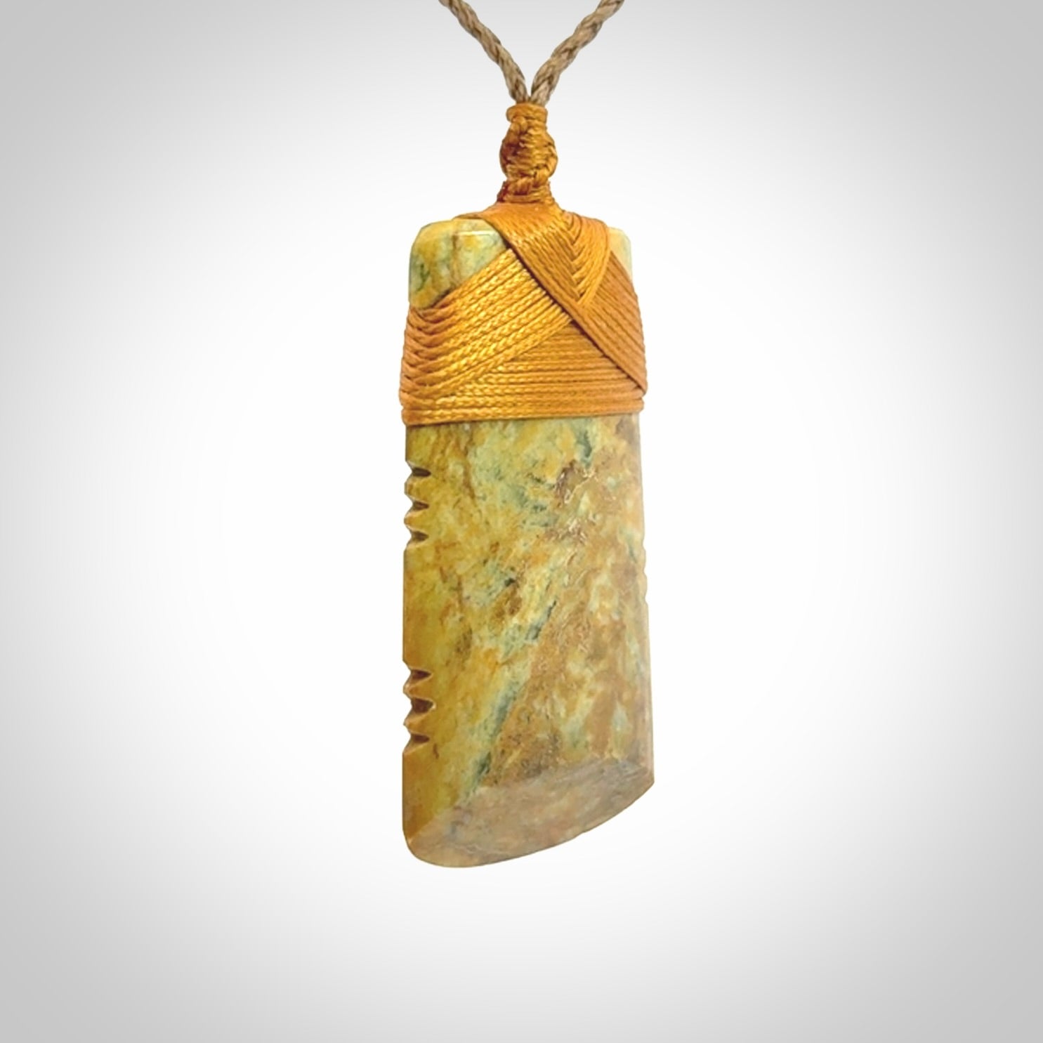 This is a lovely medium sized notched toki pendant made from a gorgeous New Zealand Flower Jade.