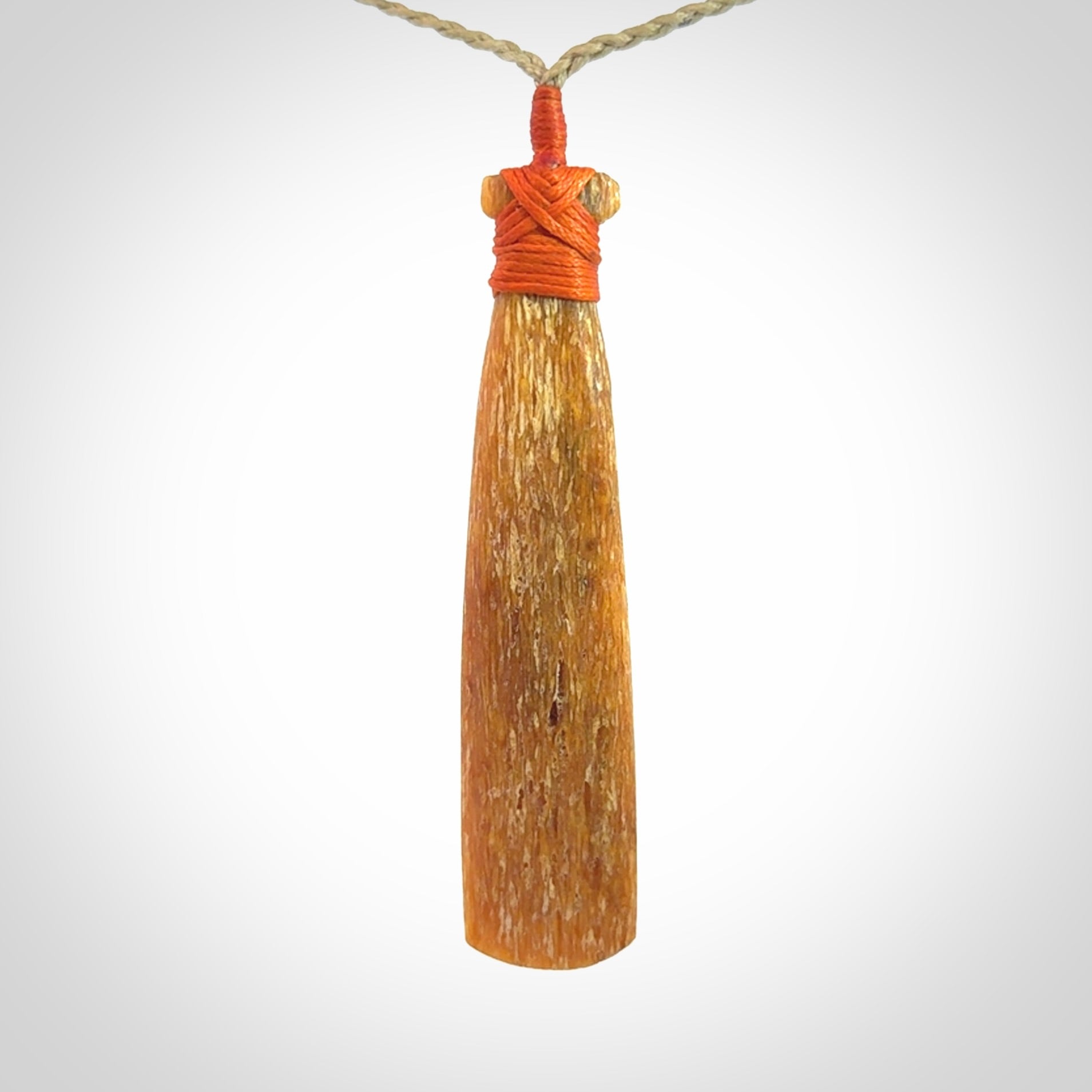 A Striking Whale Bone Toki Pendant