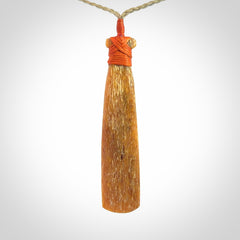 A Striking Whale Bone Toki Pendant