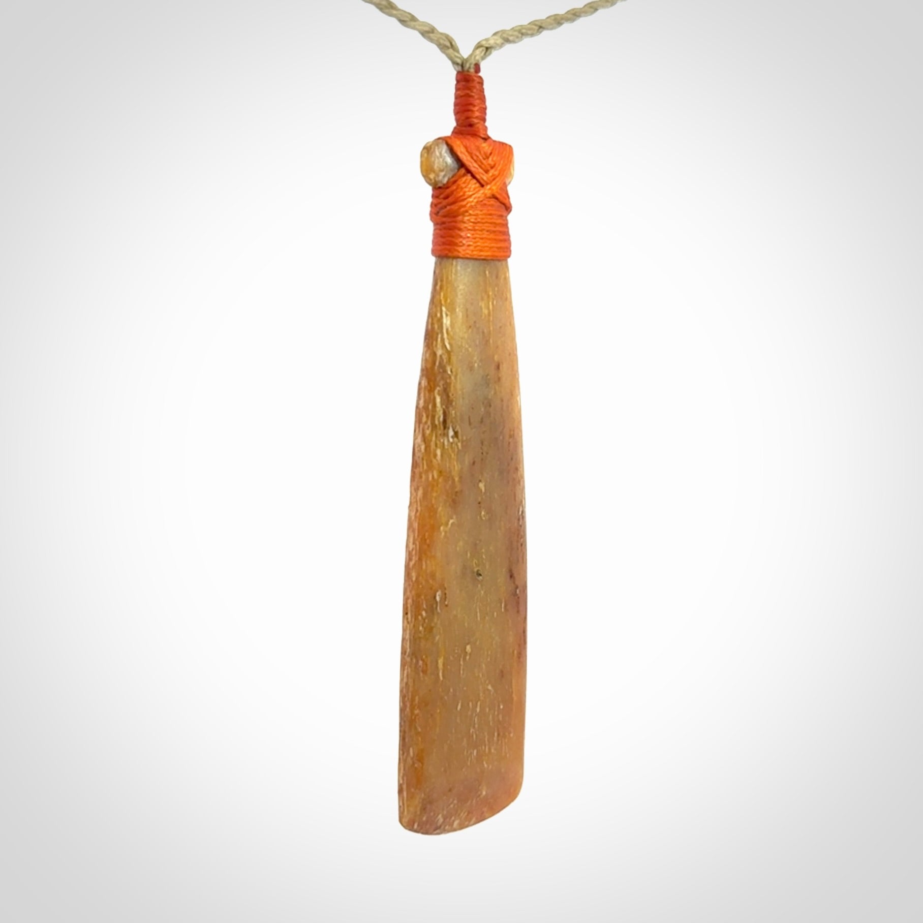 A Striking Whale Bone Toki Pendant