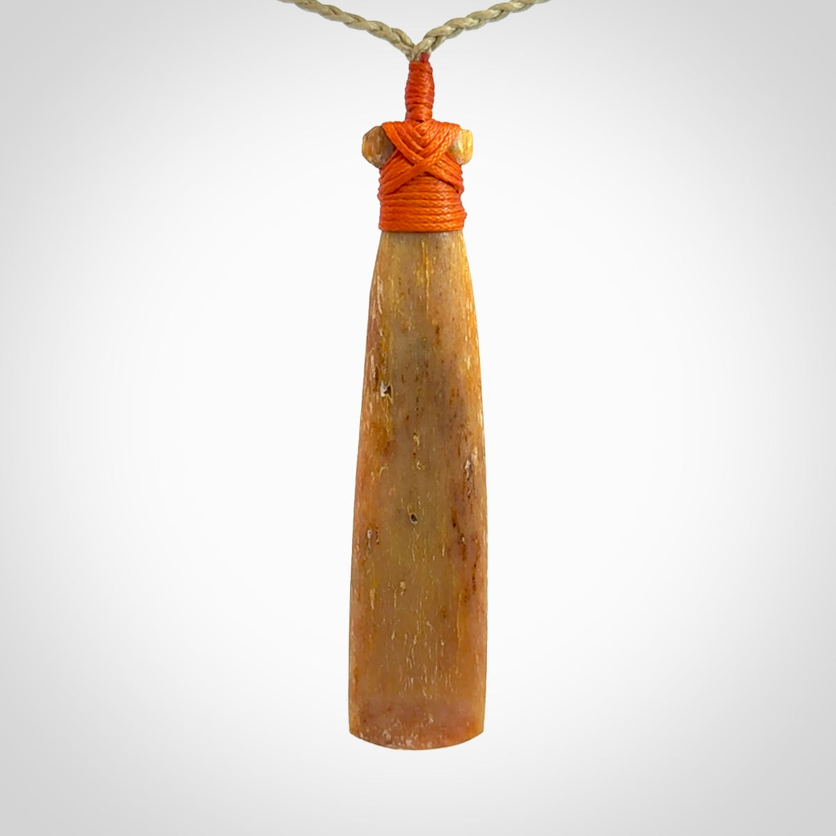 A Striking Whale Bone Toki Pendant