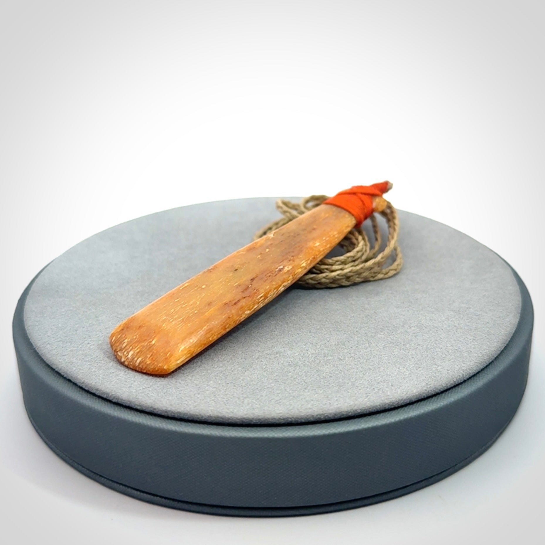A Striking Whale Bone Toki Pendant