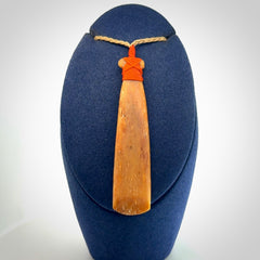 A Striking Whale Bone Toki Pendant