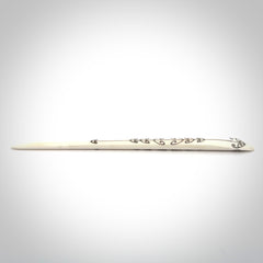 Hand carved bone hair pin with double sided koru design.