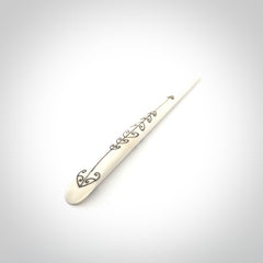 Hand carved bone hair pin with double sided koru design.