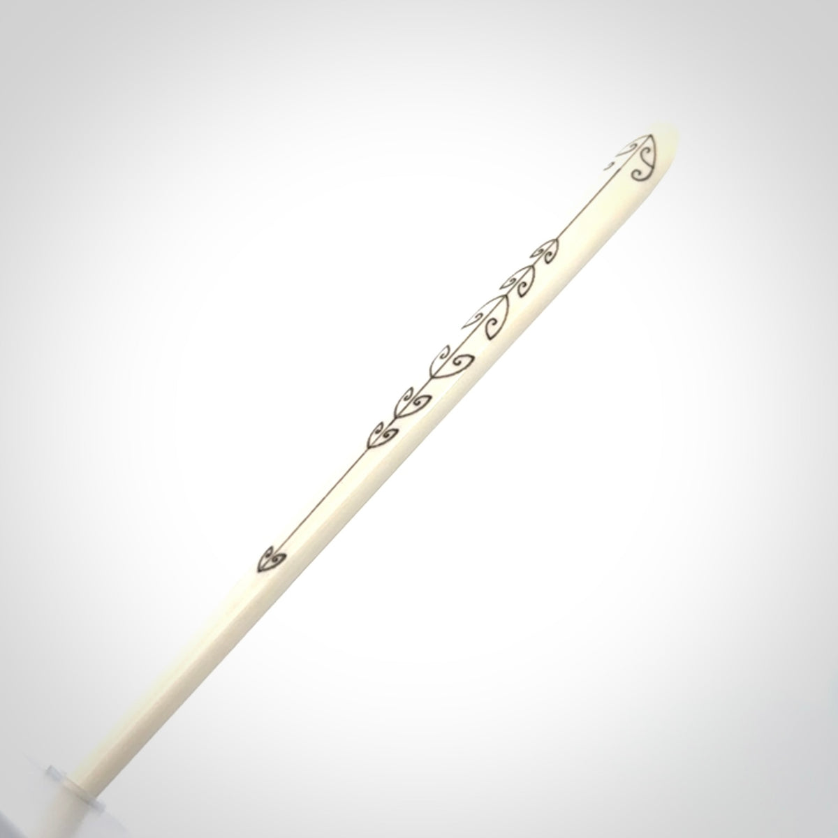 Hand carved bone hair pin with double sided koru design.