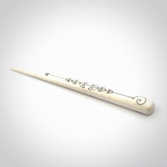Hand carved bone hair pin with double sided koru design.