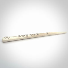 Hand carved bone hair pin with double sided koru design.