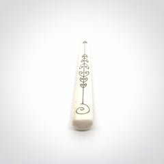 Hand carved bone hair pin with double sided koru design.