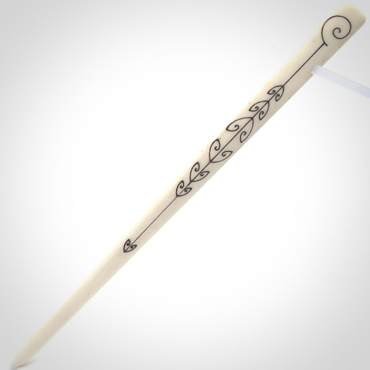 Hand carved bone hair pin with double sided koru design.