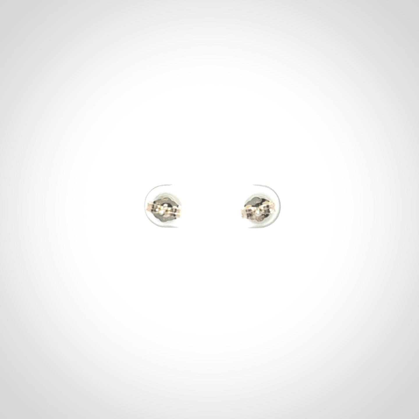Hand carved small New Zealand Jade and Sterling Silver stud earrings.