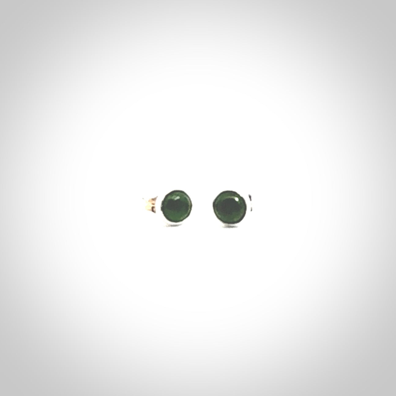 Hand carved small New Zealand Jade and Sterling Silver stud earrings.