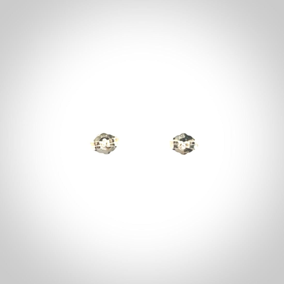 Hand carved small New Zealand Jade and Sterling Silver stud earrings.