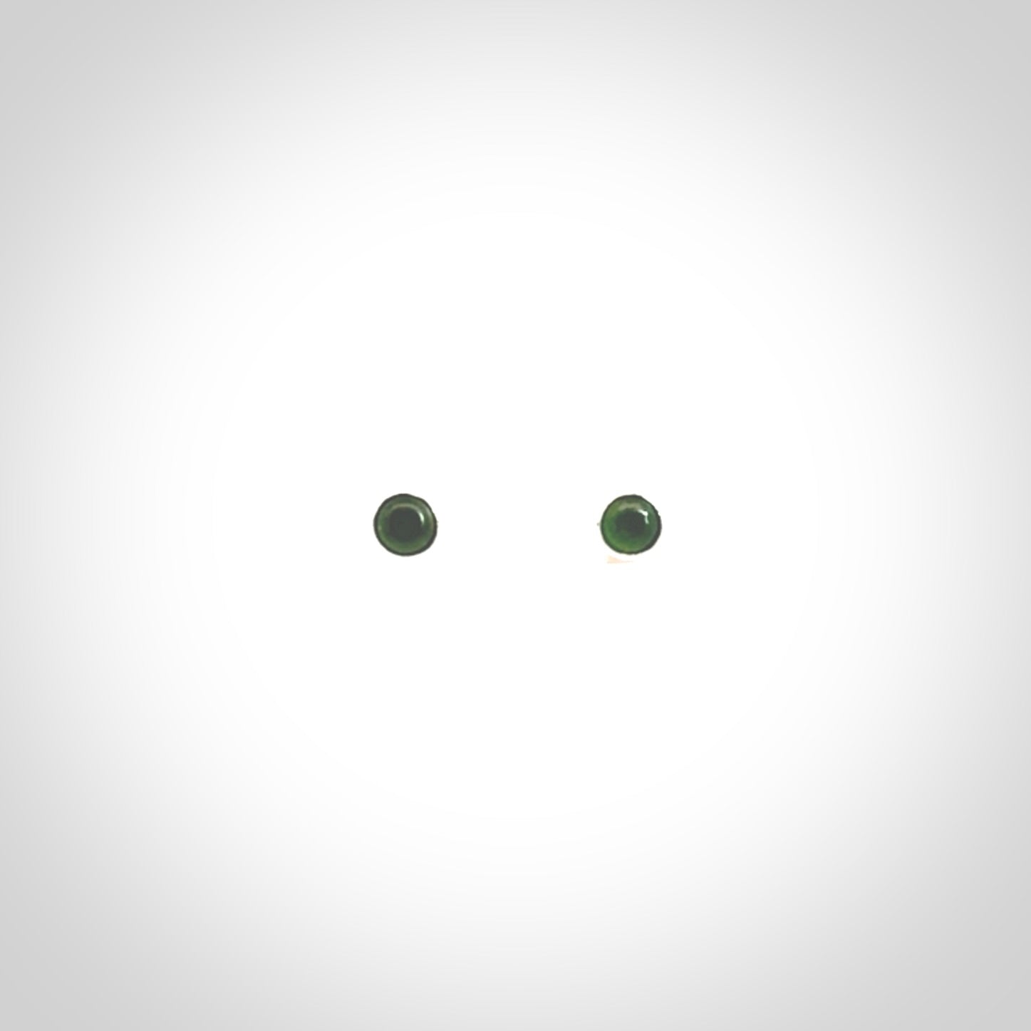 Hand carved small New Zealand Jade and Sterling Silver stud earrings.