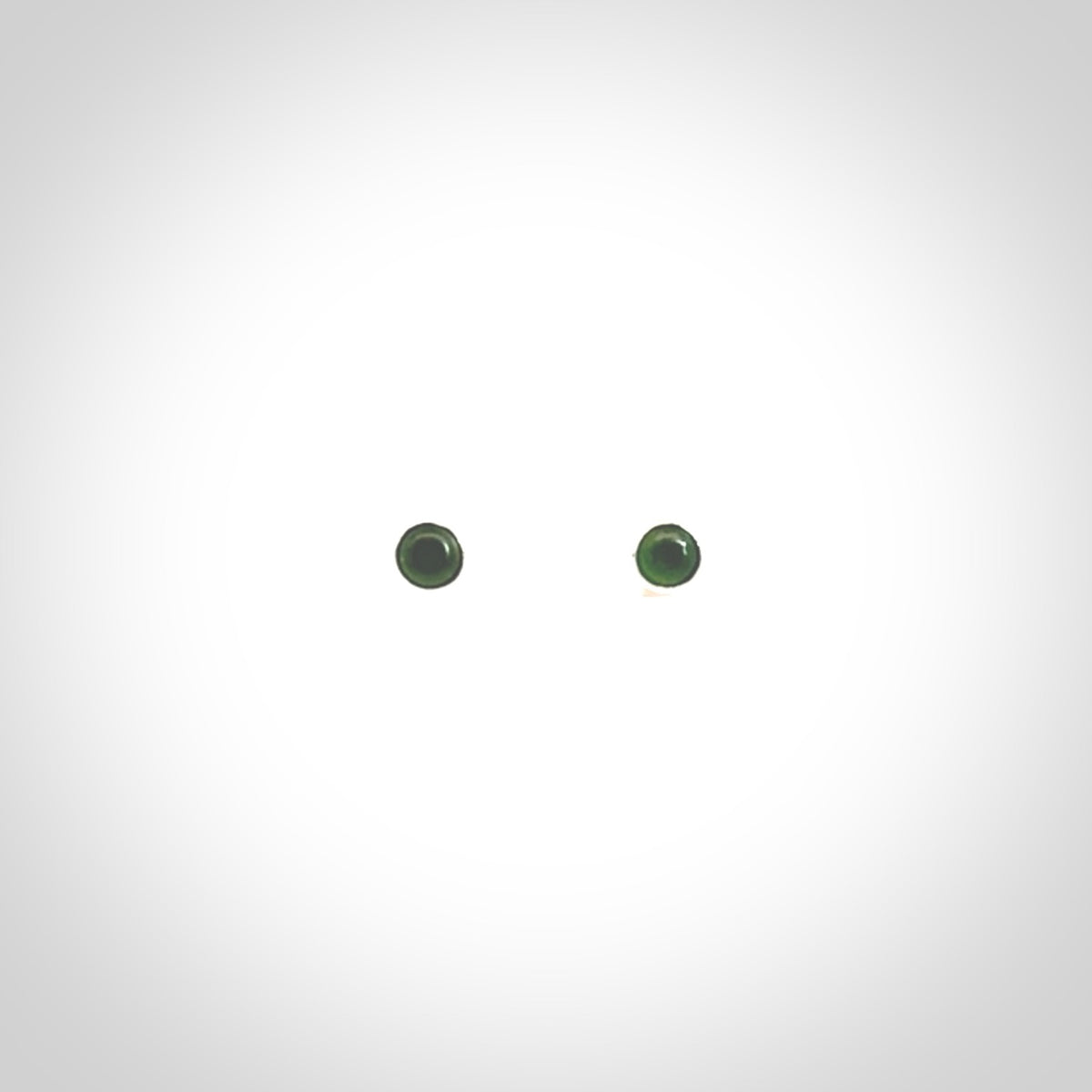 Hand carved small New Zealand Jade and Sterling Silver stud earrings.