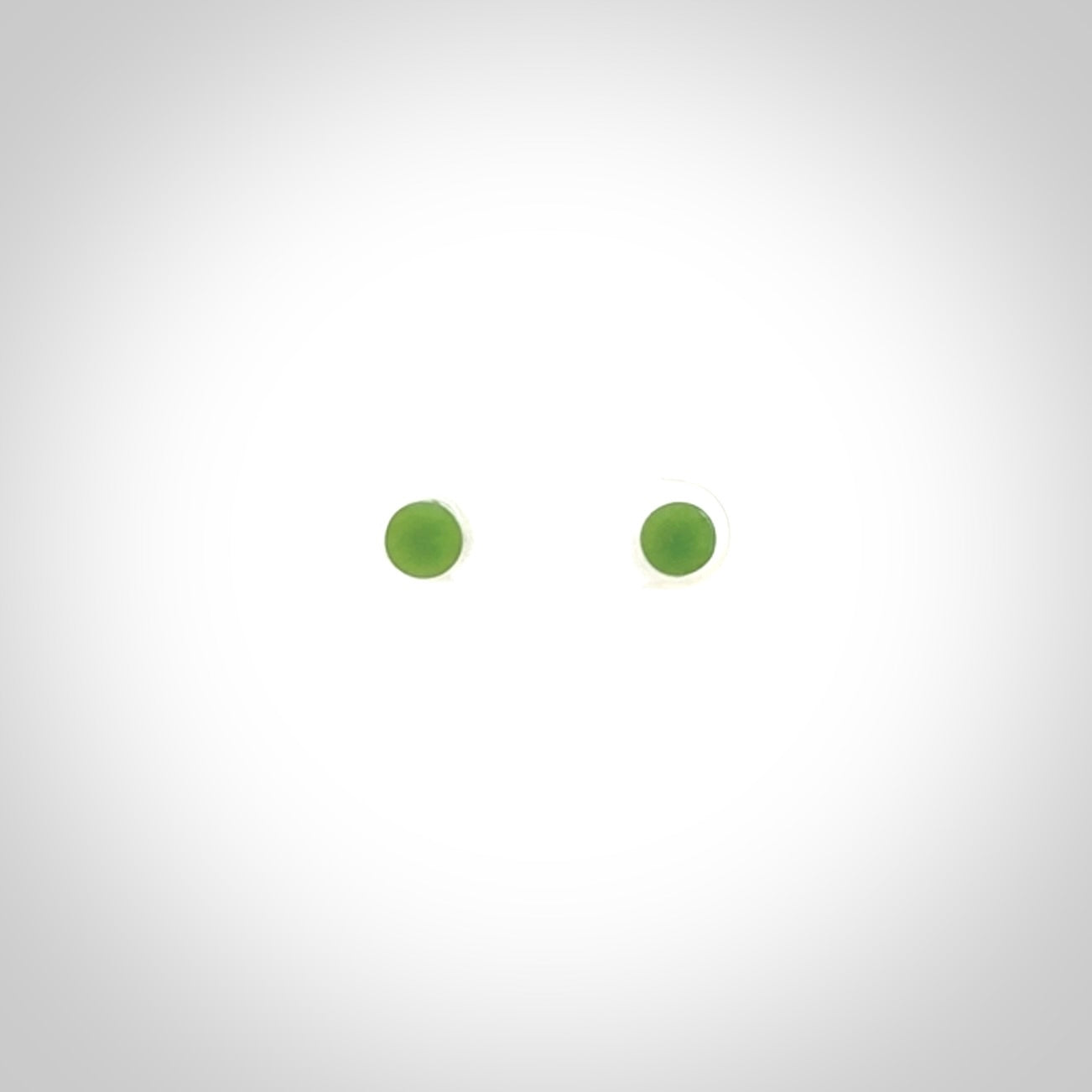 Hand carved small New Zealand Jade and Sterling Silver stud earrings.