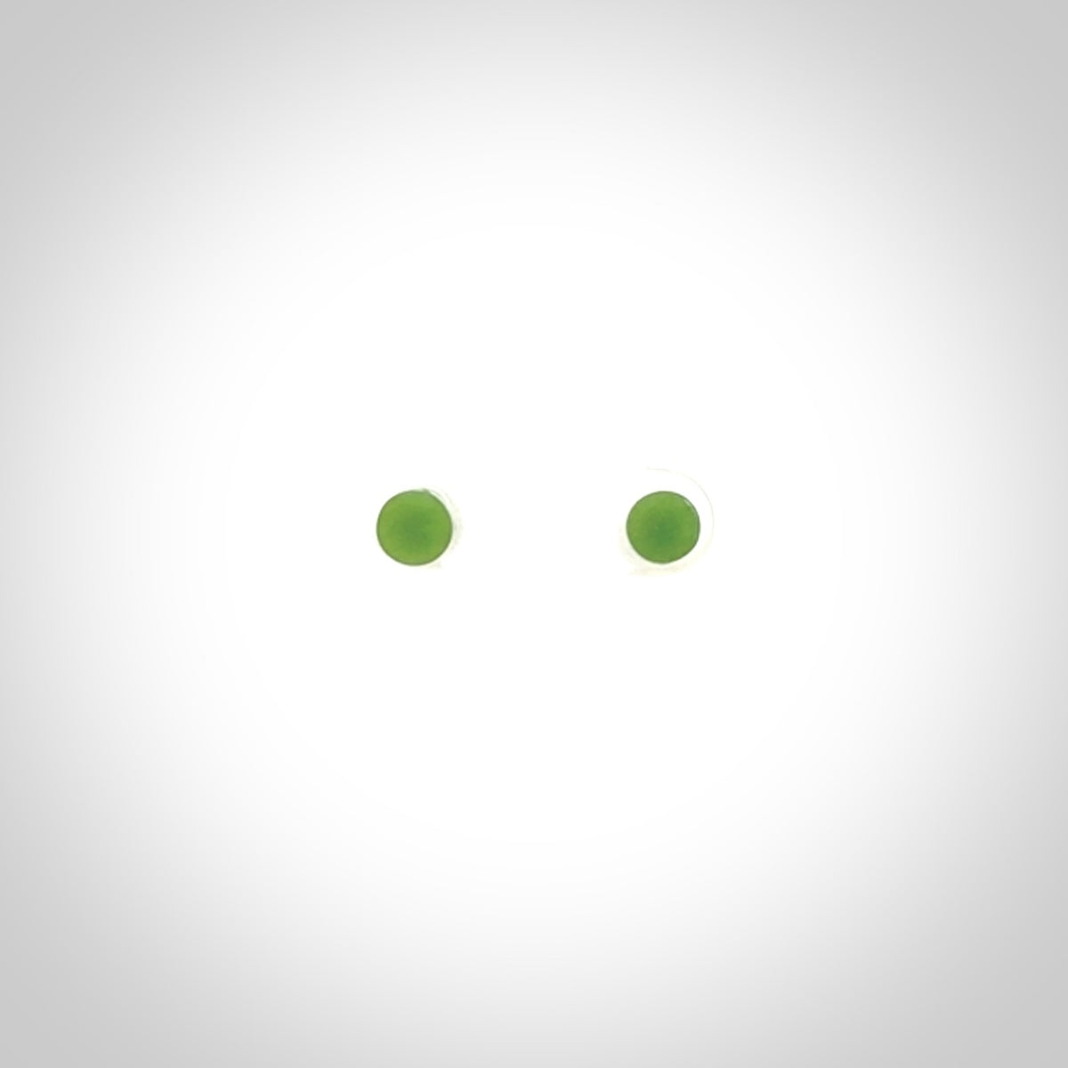 Hand carved small New Zealand Jade and Sterling Silver stud earrings.