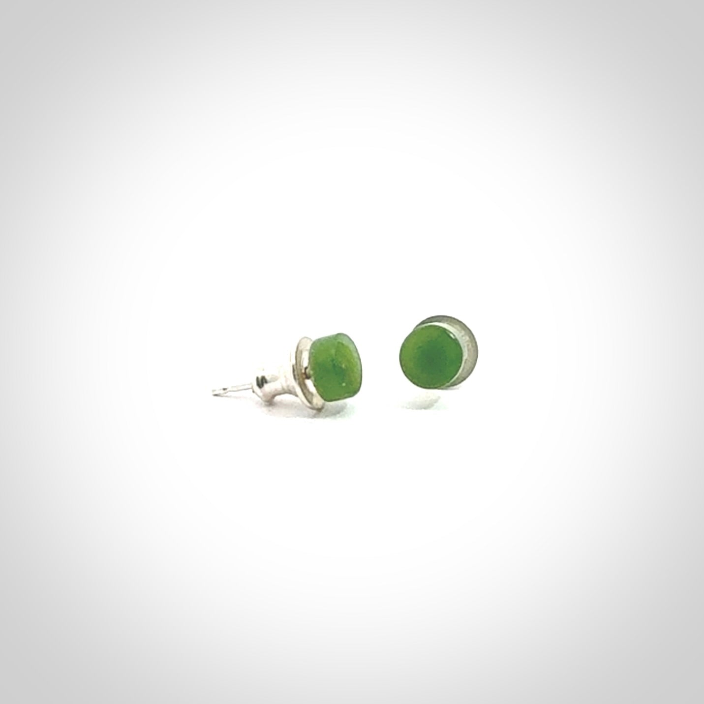 Hand carved small New Zealand Jade and Sterling Silver stud earrings.