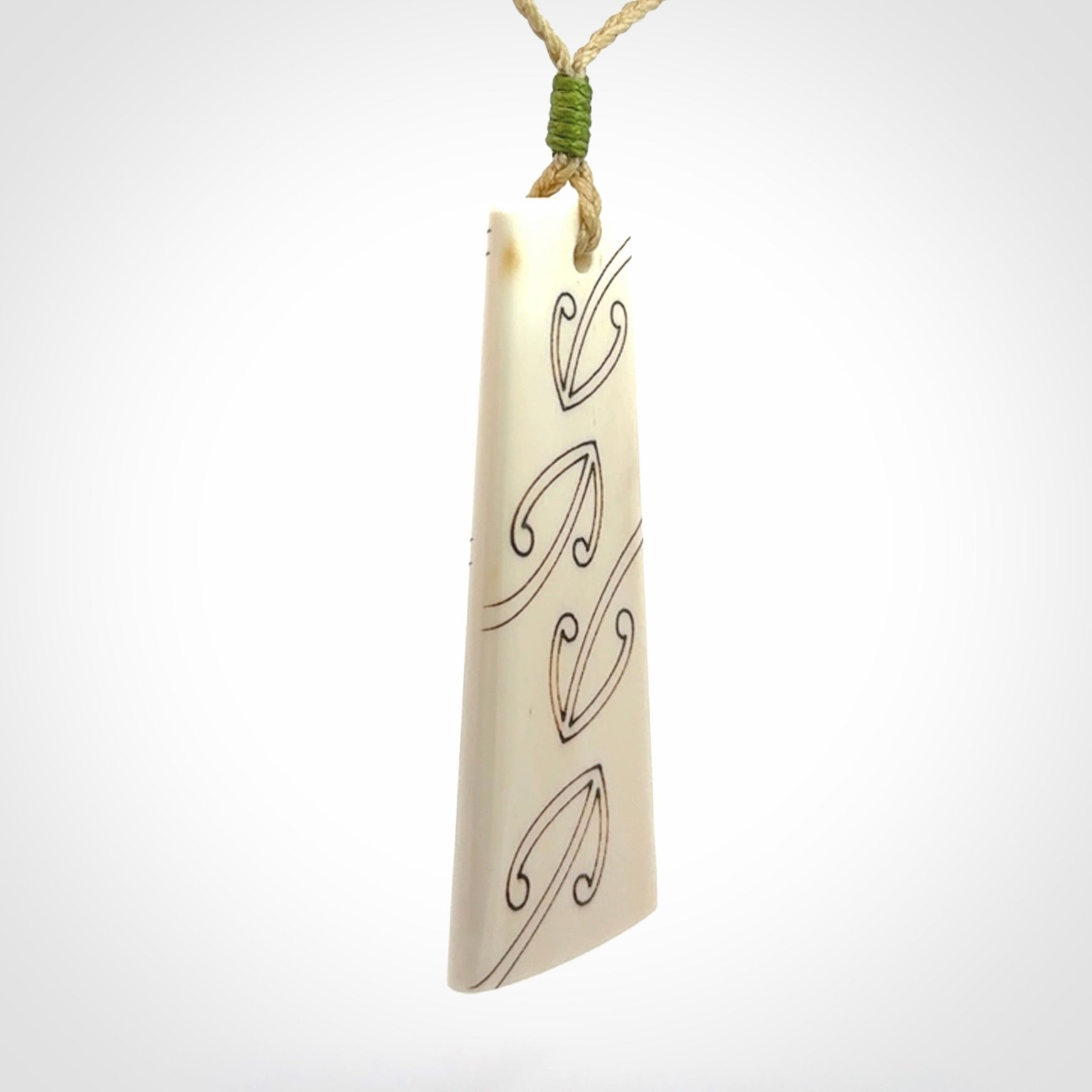 Hand carved bone toki pendant