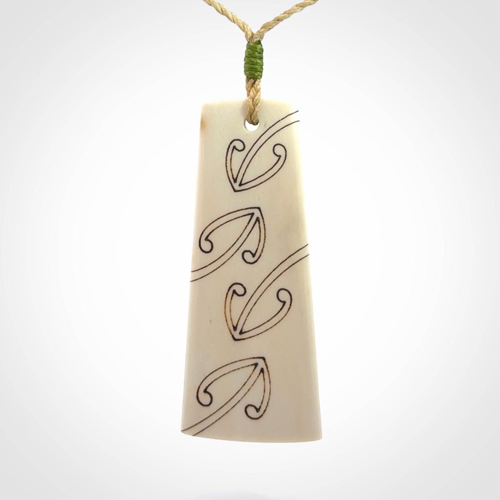 Hand carved bone toki pendant