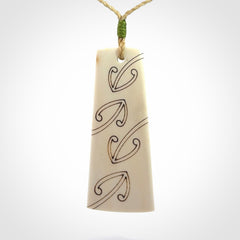 Hand carved bone toki pendant