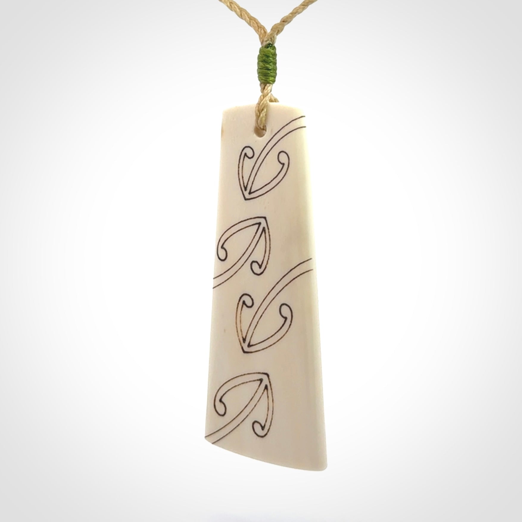 Hand carved bone toki pendant