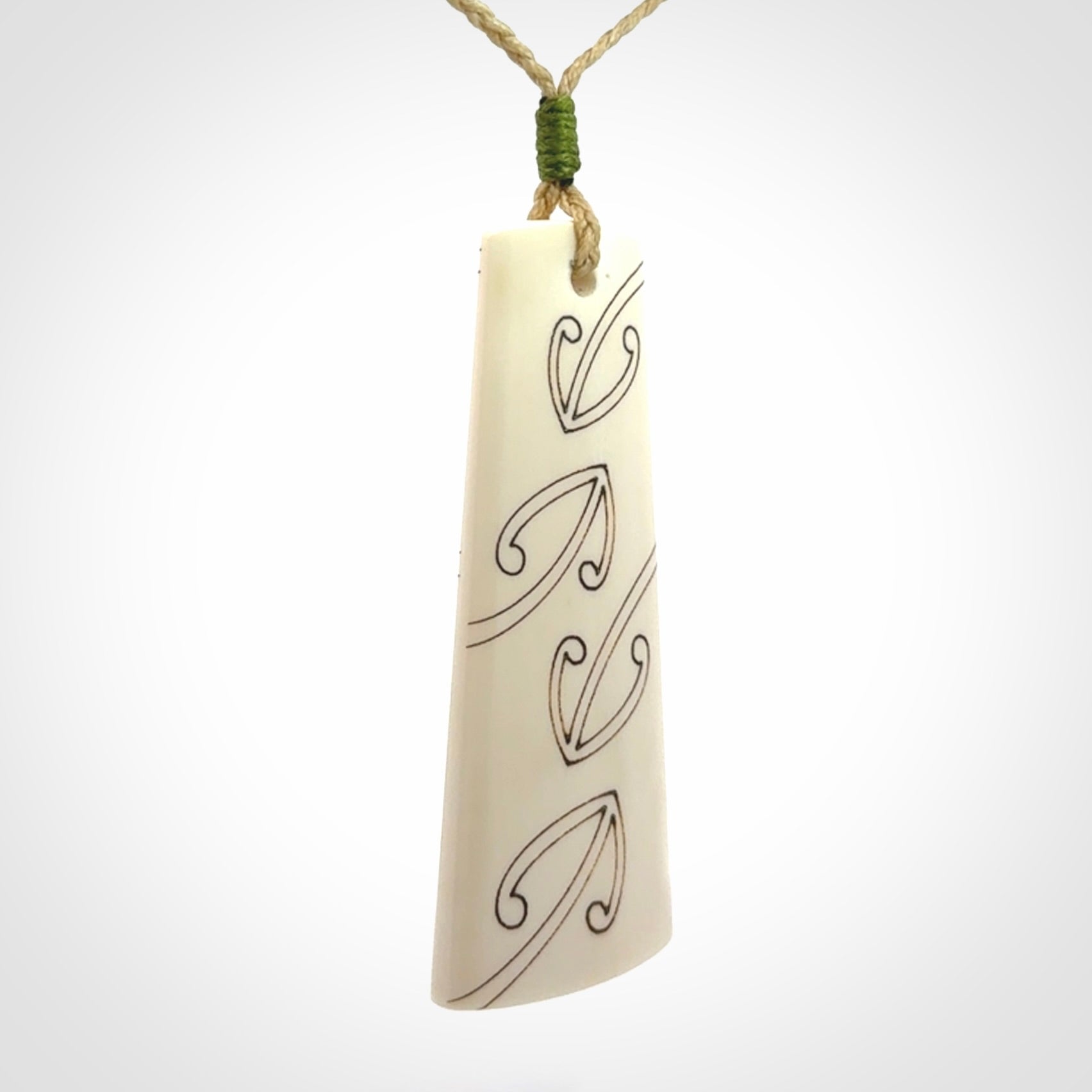 Hand carved bone toki pendant