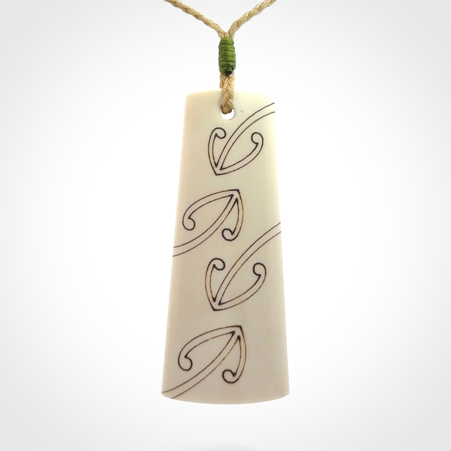 Hand carved bone toki pendant