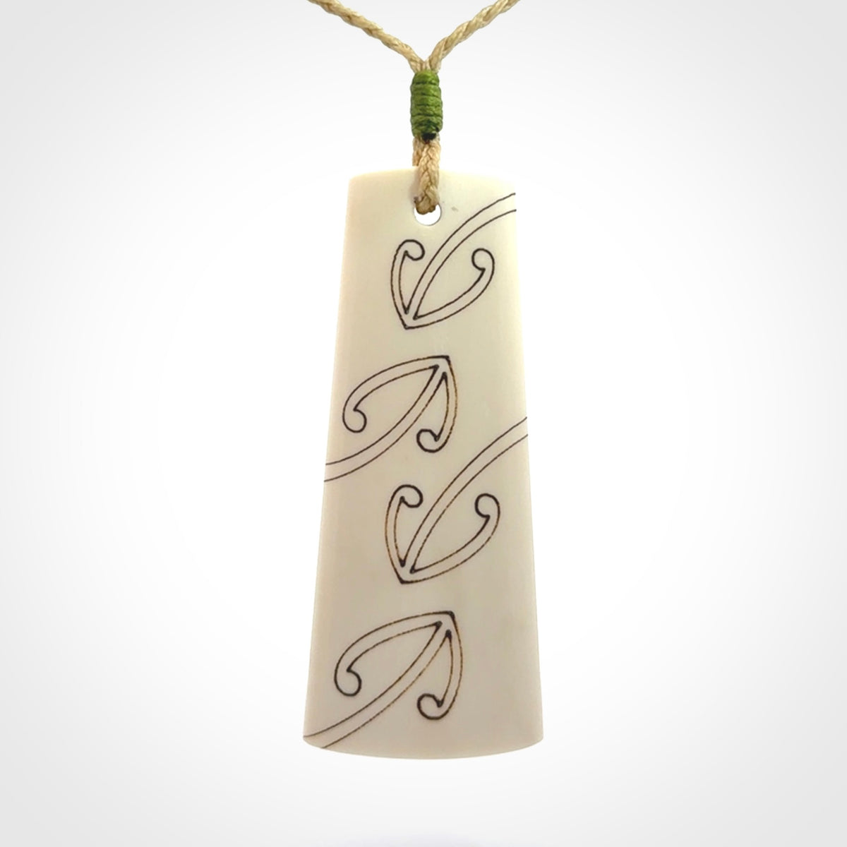 Hand carved bone toki pendant