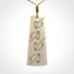 Hand carved bone toki pendant