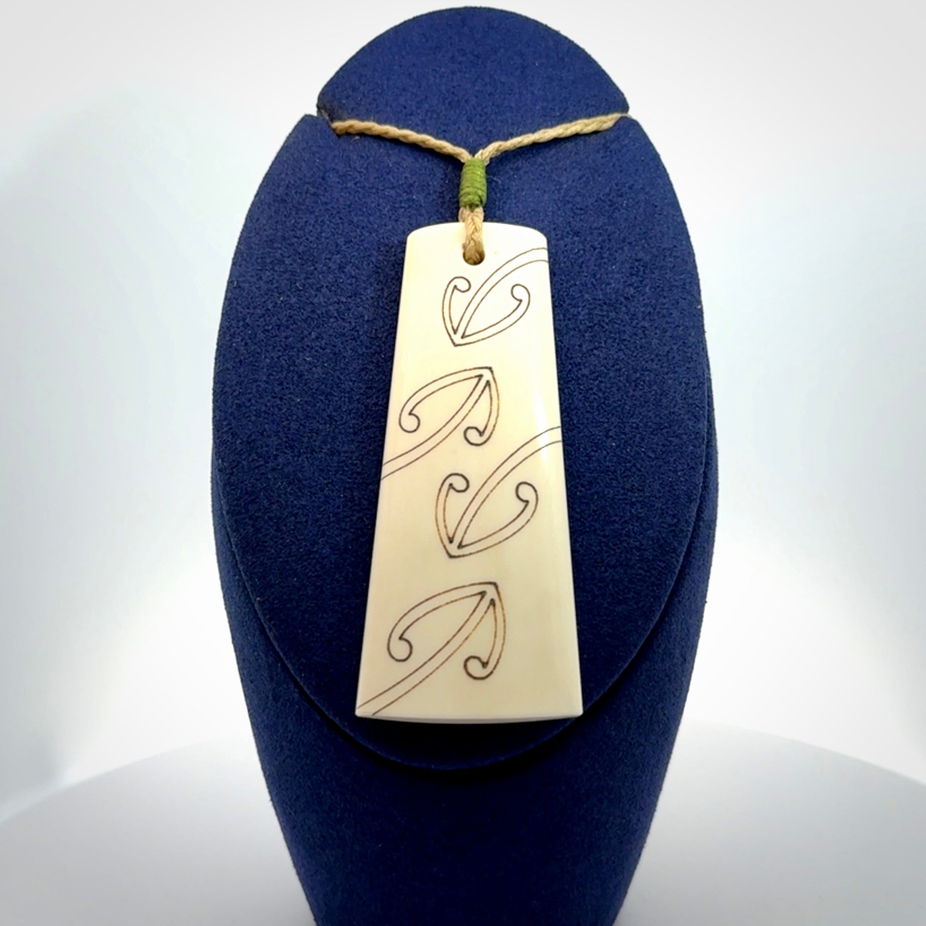 Hand carved bone toki pendant
