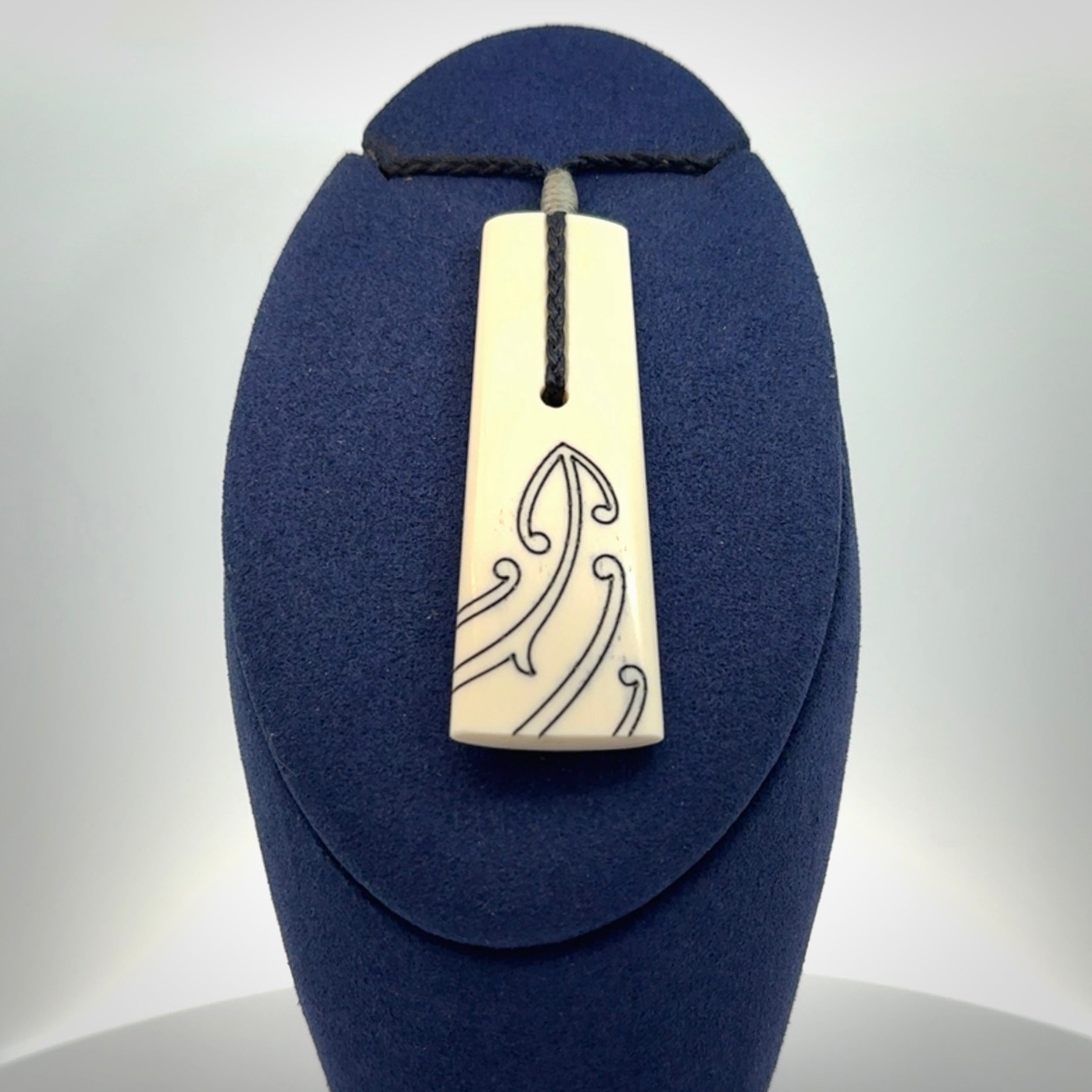 Hand carved bone toki pendant