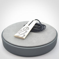 Hand carved bone toki pendant