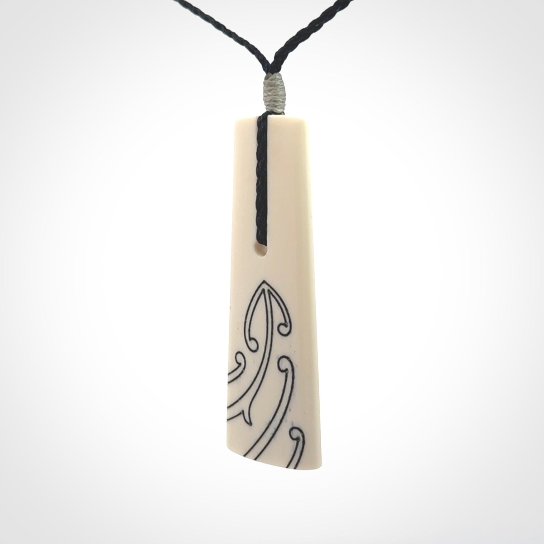 Hand carved bone toki pendant