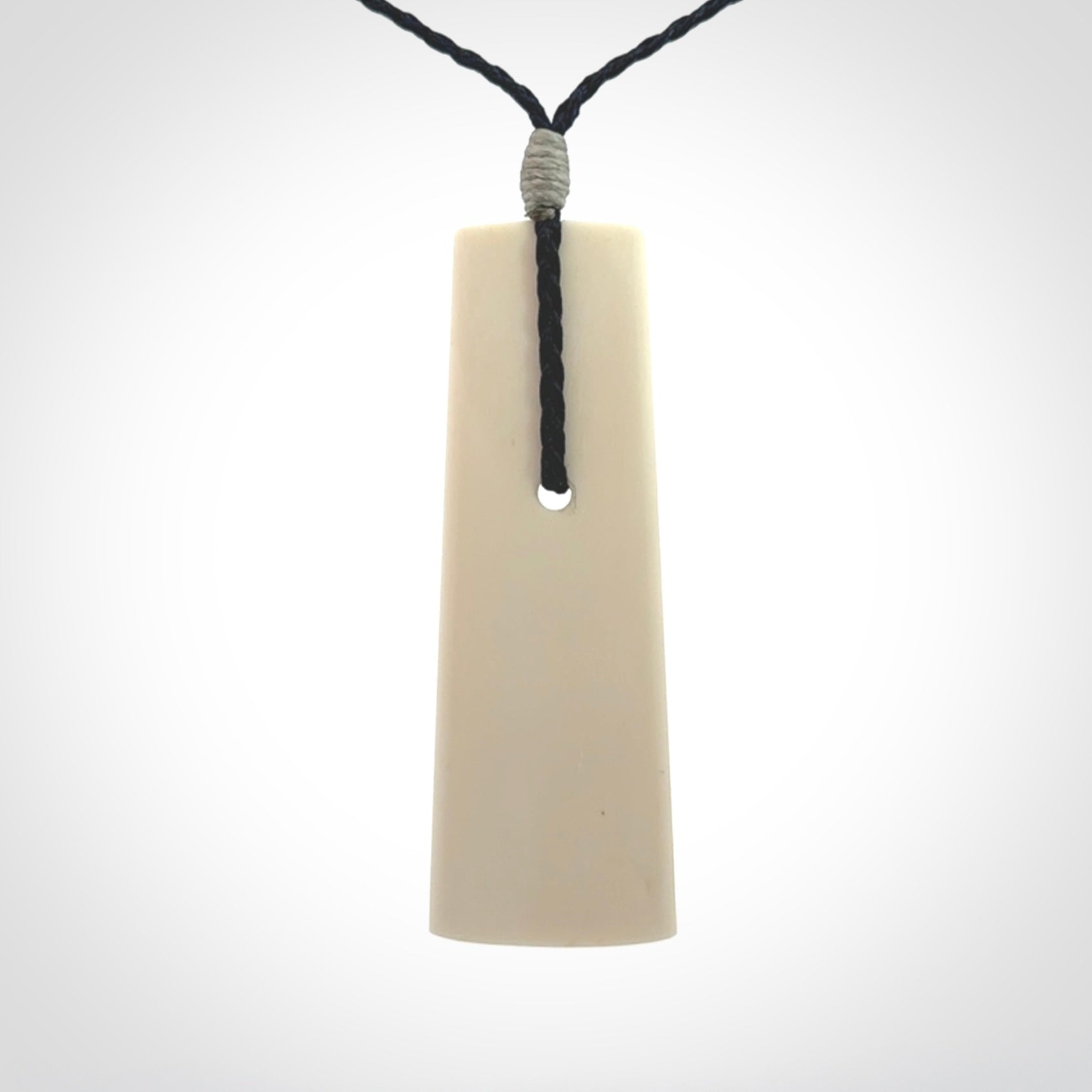 Hand carved bone toki pendant