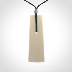 Hand carved bone toki pendant