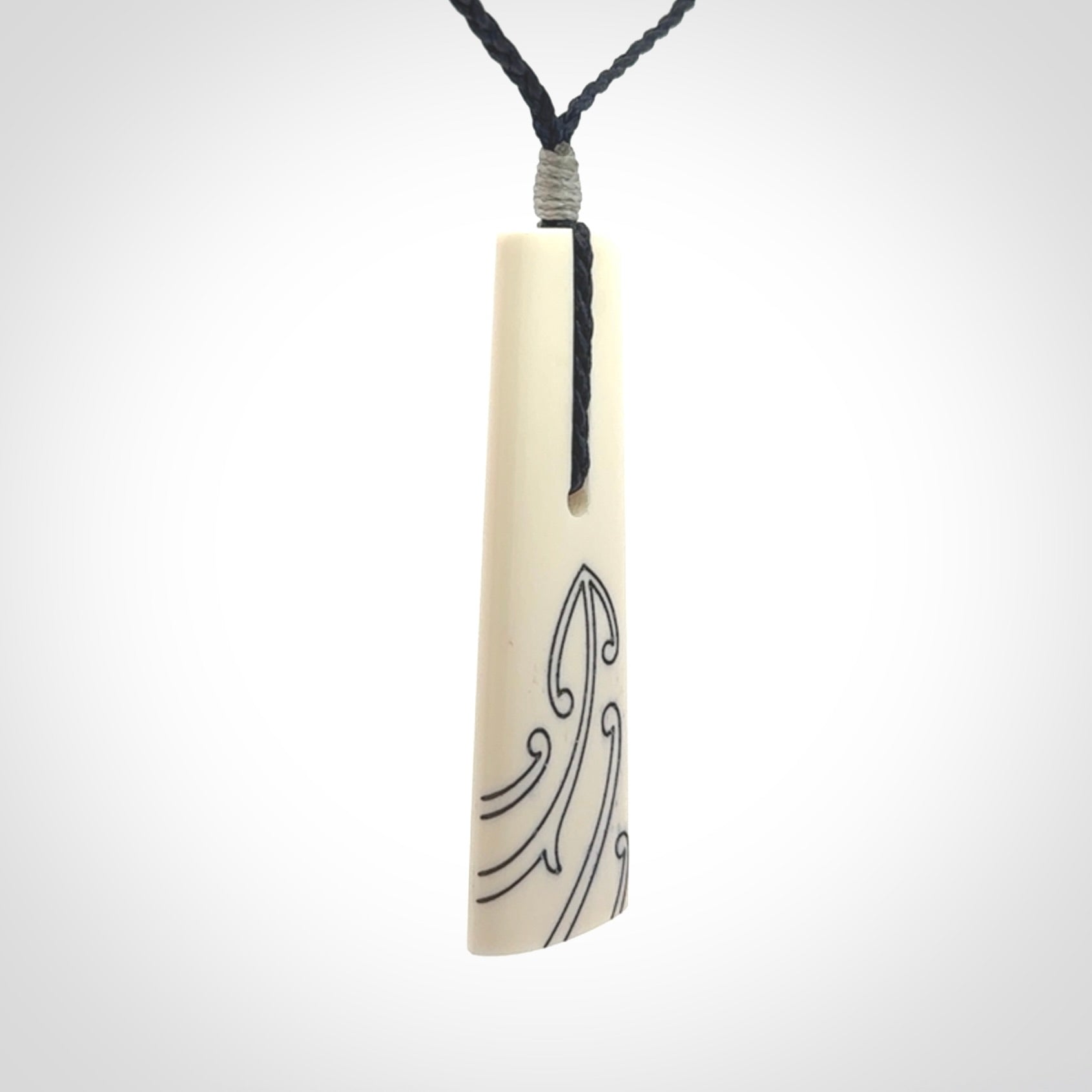 Hand carved bone toki pendant