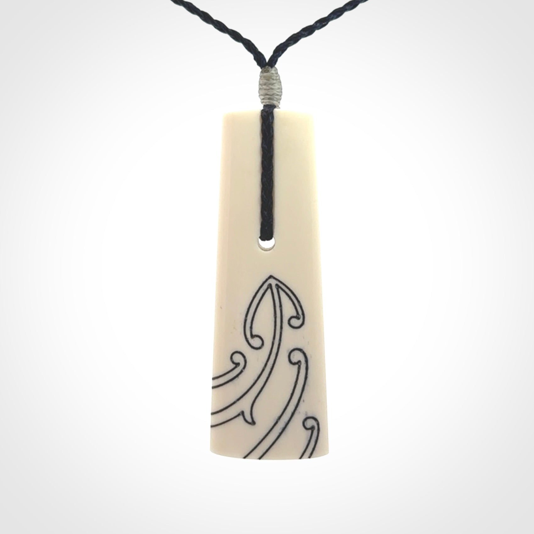 Hand carved bone toki pendant