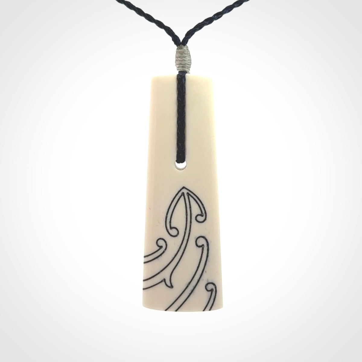 Hand carved bone toki pendant