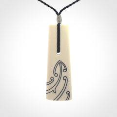 Hand carved bone toki pendant