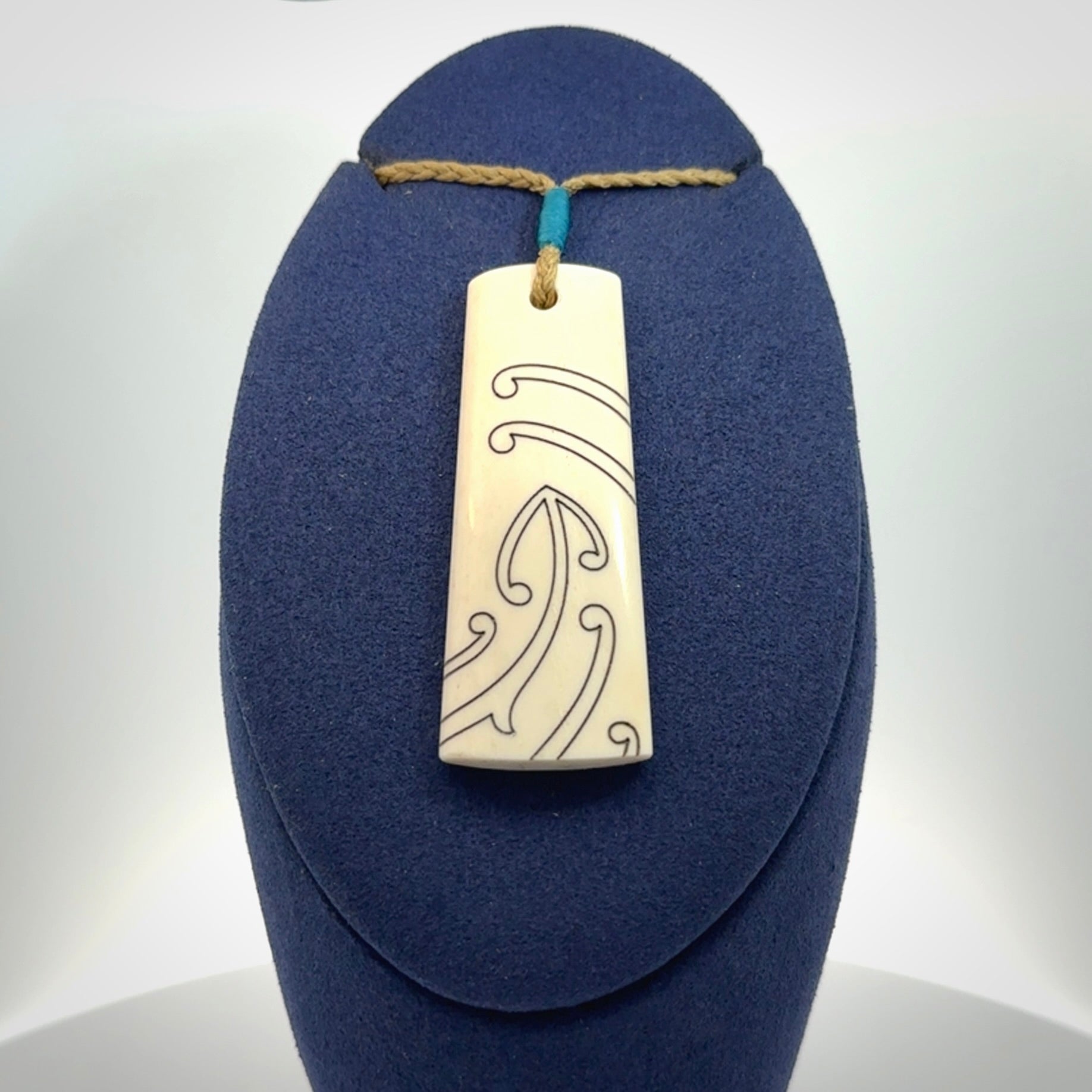 Hand carved bone toki pendant