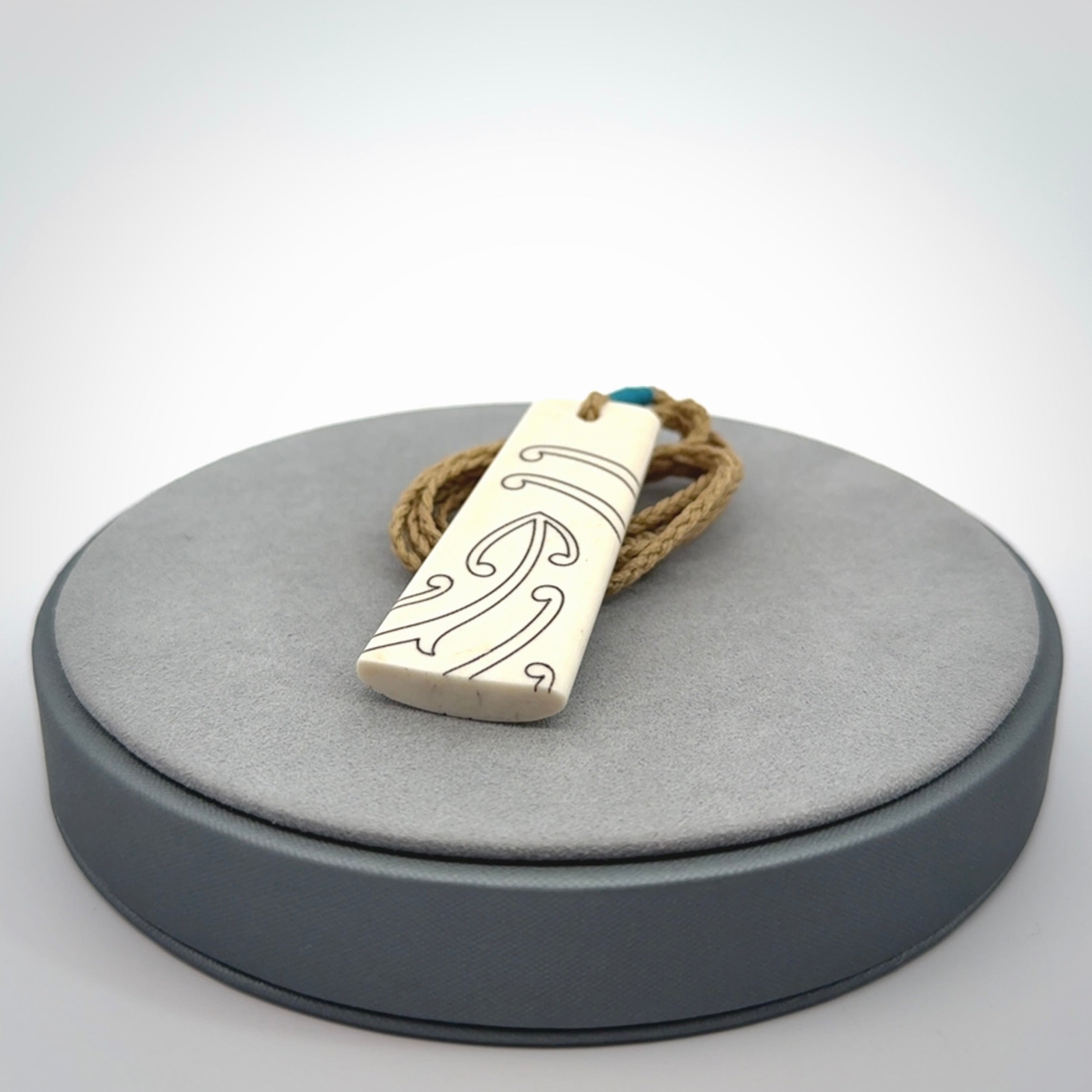 Hand carved bone toki pendant