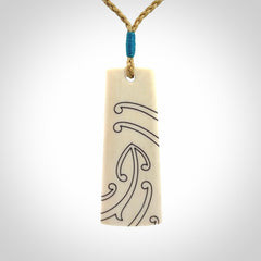 Hand carved bone toki pendant