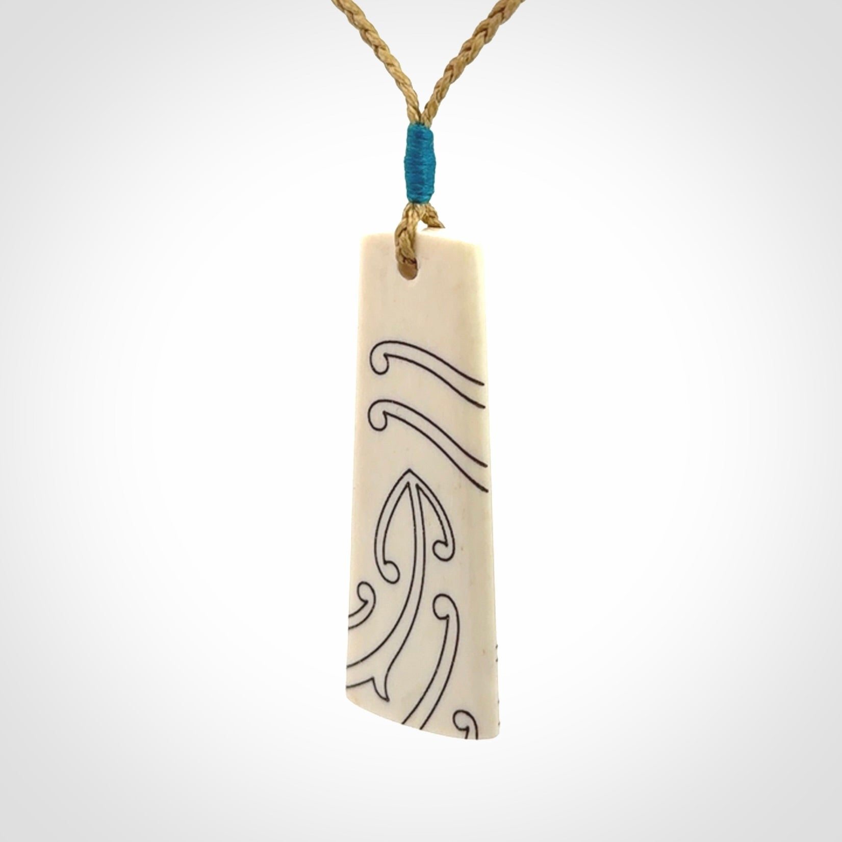 Hand carved bone toki pendant