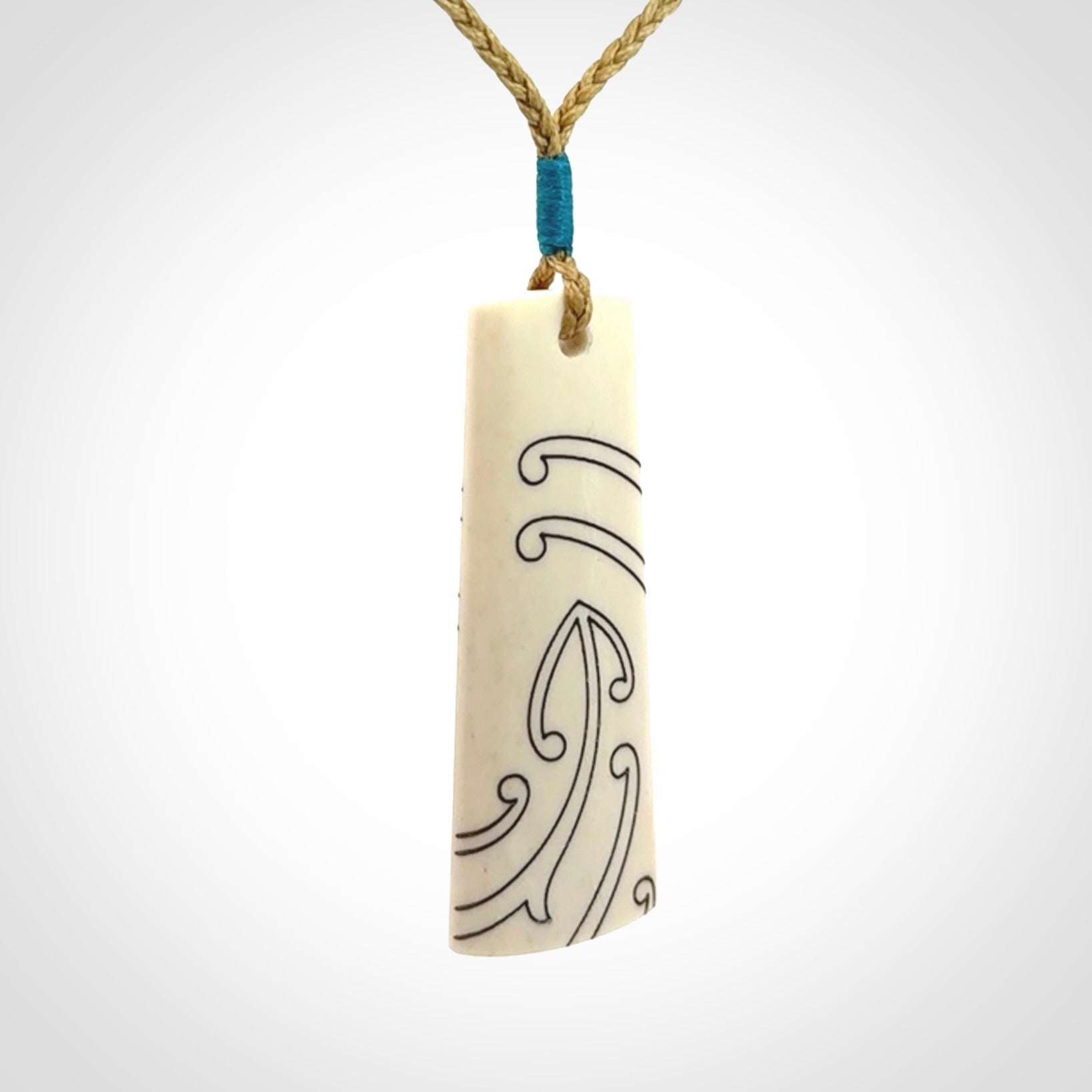 Hand carved bone toki pendant