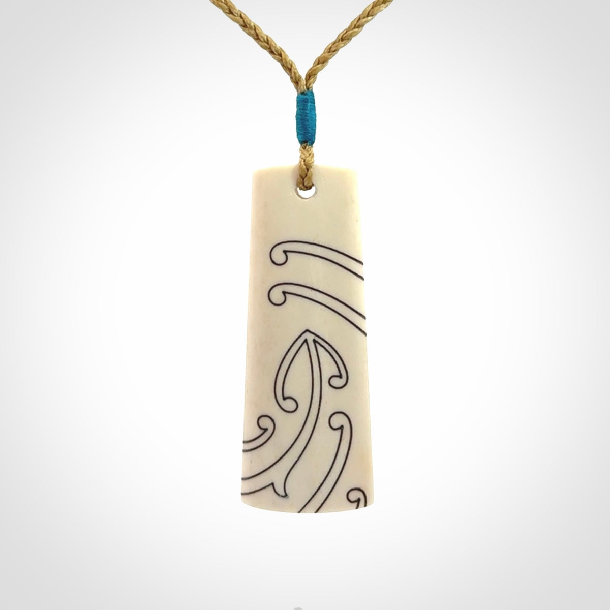 Hand carved bone toki pendant