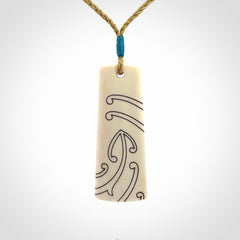 Hand carved bone toki pendant