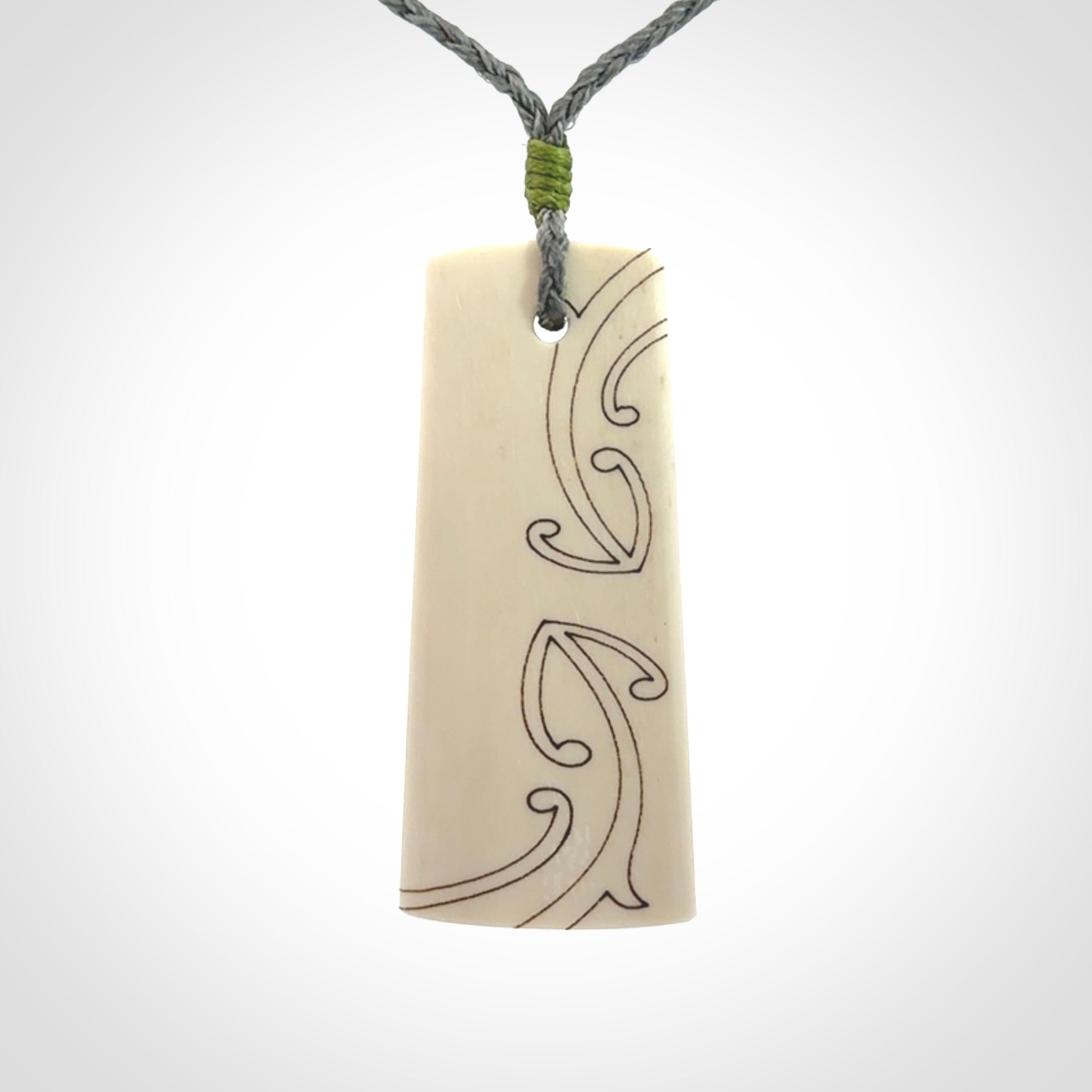 Hand carved bone toki pendant