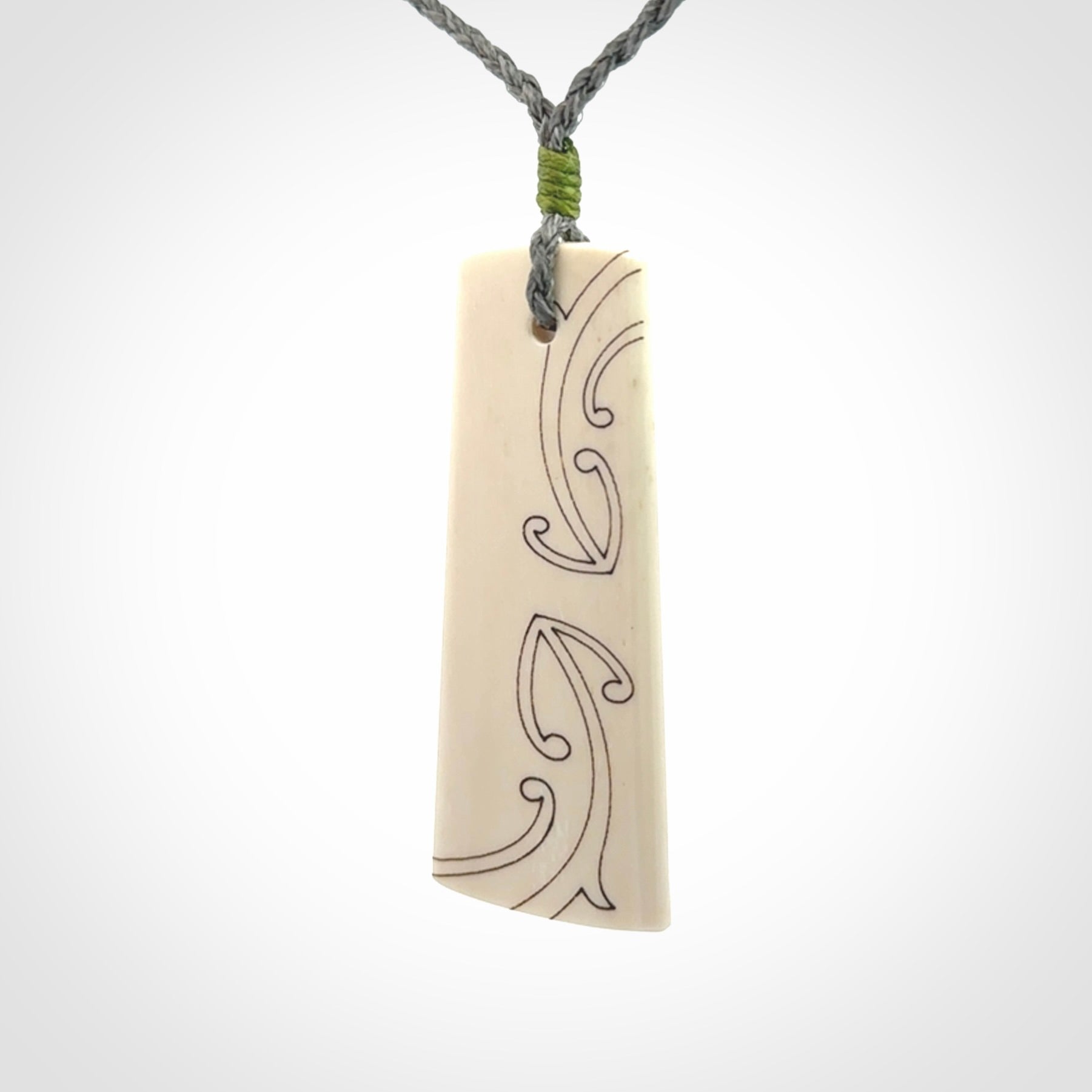 Hand carved bone toki pendant