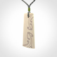 Hand carved bone toki pendant